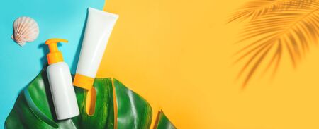Sunprotection objects, suscreen. Prevention of photoaging. Flat lay, natural cosmetics SPF for face and body. Summer Travel Vacation Concept Bannerの写真素材