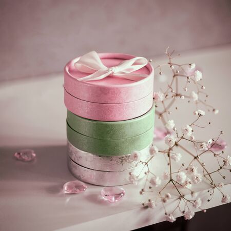 Set of gift boxes in pastel shades with delicate flowers. Female greeting card concept. Gifts for...