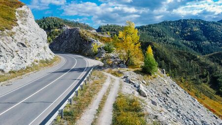 Winding mountain road. Mountain pass. Landscape aerial view of a drone. Altaiの写真素材