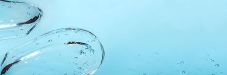 Texture of hyaluronic acid, serum gel. Transparent smear of gel isolated on white background Banner