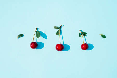Pattern from Beautiful ripe cherries berries. Comfort food concept. Summer background. Banner. Flat lay, minimalist composition Social distance conceptの写真素材