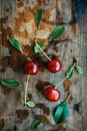 Ripe cherries on a wooden windowsill. Cottagecore Aesthetics. Rustic, vintage style Juicy summer...