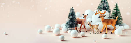 Christmas, winter composition: a family of deer in the winter forest. Happy Christmas and New Years concept. Bannerの写真素材