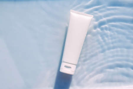 Cosmetic moisturizer cream , micellar toner, or emulsion with granules. abstract beauty background....
