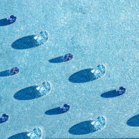 Pattern of glittering crystals of shine rhinestones, abstract festive background Flat lay, hard shade from the sunの写真素材