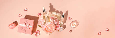 Natural cosmetics, serum and extracts, natural skin care combined with flowers and gifts. Spring gifts concept for womens holiday Bannerの写真素材