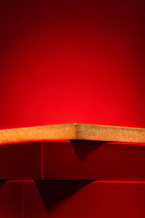 Majestic red podium made of gift boxes Red background ..の写真素材