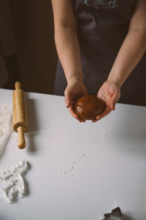 Smiling Prostok girl with glasses lies under the Christmas tree with giftsの写真素材