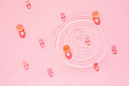 Abstract cosmetic pink water background for spa and moisturizing medical cosmetics