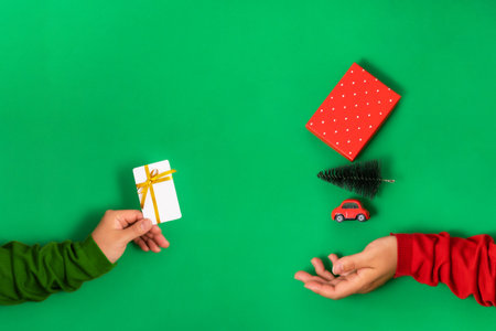 Bank, bonus card in hand virtually pays for New Years purchases Bright green background