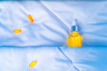 Cosmetic Serum, Vitamin Oil Capsules, Omega-3, Skin Care Night Health. Concept of natural relaxation, rejuvenation during sleep, cosmetic essence, melatonin, vitamins protect health, beautyの写真素材
