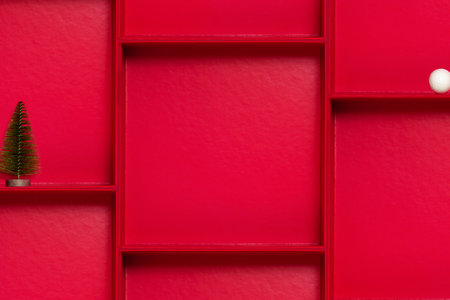 Clean red modular layout with small christmas tree and open box. Festive copy space template for banner, poster, social media and sale design.の写真素材