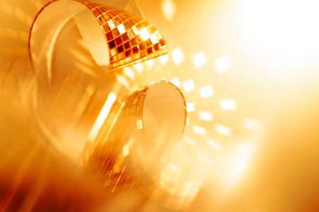 Abstract sparkling golden background for promo and holidays. Festive luxury banner background with copy space for sale and events.の写真素材