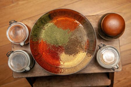 Ground spices in a bowl with bay leafの写真素材