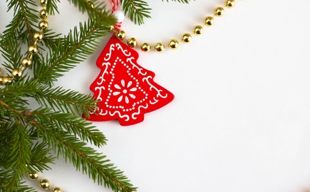 Christmas toy and fir tree on a white backgroundの写真素材