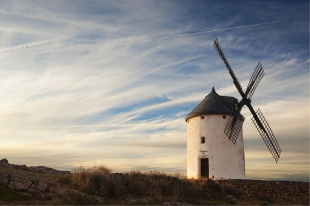 Old windmill at the sunset in Consuegra, Spainの写真素材