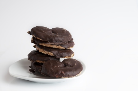 Chocolate cookies on a withe plate isolated on withe backgroundの写真素材