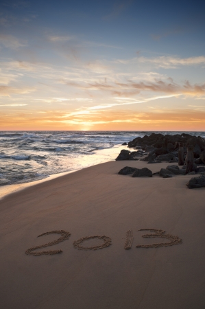 2013 writen on the sand at the sunsetの写真素材