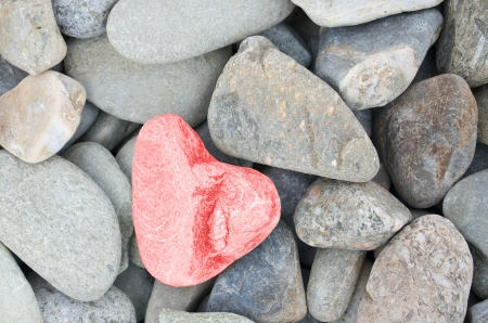 heart shaped stone painted redの写真素材
