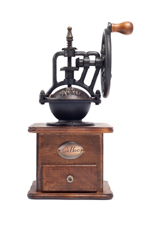old manual coffee grinder, wood and metal, isolated on whiteの写真素材