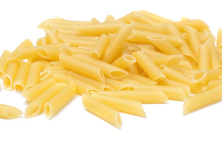 Some raw penne macaroni isolated on white backgroundの写真素材
