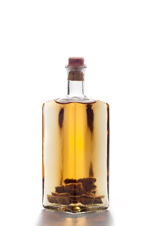bottle of homemade liquor isolated on white backgroundの写真素材