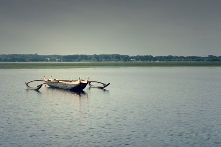 small wooden catamaran in the Soustons lakeの写真素材