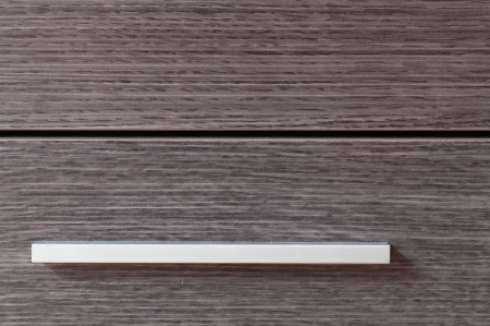 Closet metalic handle and wooden doorsの写真素材