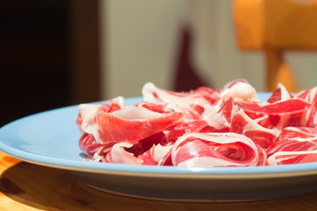 Tipical spanish serrano ham in a plateの写真素材