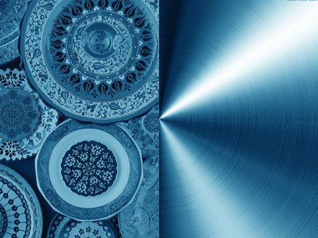 against the background of blue metal texture, painted plates.の写真素材