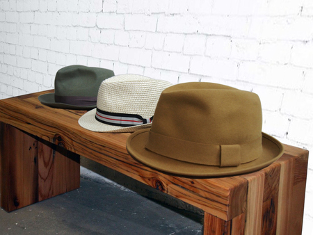 three colored men's hats. on a white backgroundの写真素材