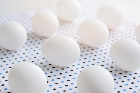 White eggs on polka dot fabric, easter conceptの写真素材