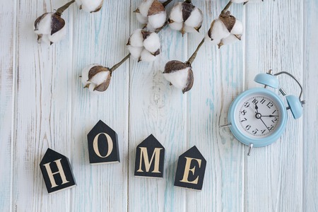 Beautiful white cotton flowers on turquoise wooden backgroundの写真素材