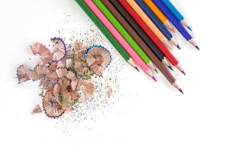 Colorful pencils and shavings on white background, top view, isolatedの写真素材