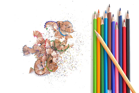 Colorful pencils and shavings on white background, top view, isolatedの写真素材