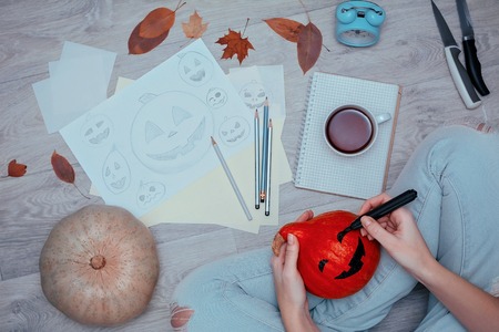 Drawing pencil sketches of halloween pumpkins. Preparation to halloween holiday.の写真素材