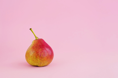Group of yellow pears on pale pink background, harvest conceptの写真素材