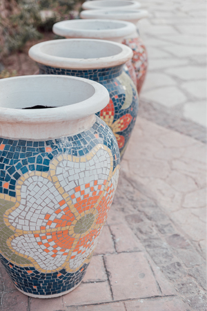 Group of big clay jars with mosaic. Vertical, copy space.