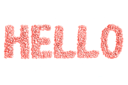 Word hello made of small coral stones on white background. Isolated, top view.の写真素材