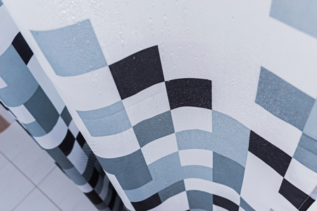 White bathroom with black and white shower curtain. Bathroom interior.の写真素材