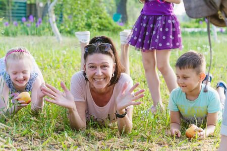 ENERGODAR, UKRAINE - May, 2018: happy smiling children are playing with their kindergartener outdoors in sunny day.のeditorial素材