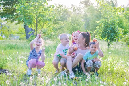 ENERGODAR, UKRAINE - May, 2018: happy smiling children are playing with their kindergartener outdoors in sunny day.のeditorial素材