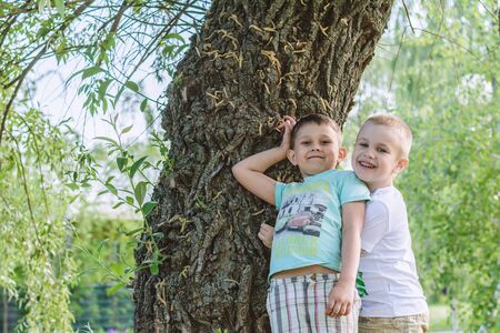 ENERGODAR, UKRAINE - May, 2018: two happy smiling boys are playing outdoors in sunny day.のeditorial素材