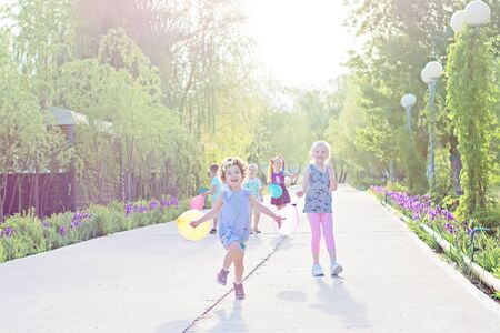 ENERGODAR, UKRAINE - May, 2018: happy smiling children are playing outdoors in sunny day.のeditorial素材