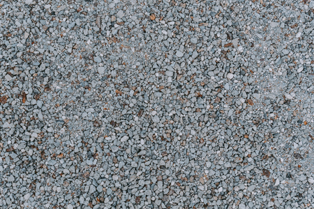 Natural small stones background grey color. Natural texture. Top view.の写真素材