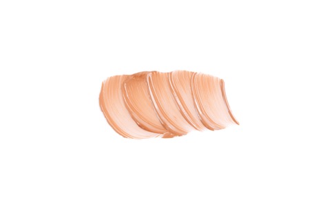 Beige smear of foundation. Cosmetics concept isolated on white background. Top view.の写真素材