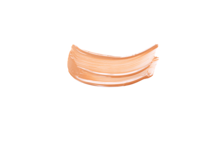 Beige smear of foundation. Cosmetics concept isolated on white background. Top view.の写真素材