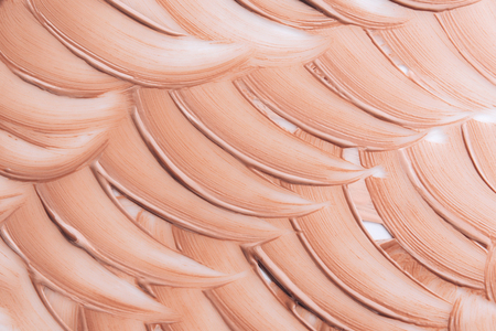 Beige smear of foundation texture. Cosmetics concept isolated on white background. Top view.の写真素材
