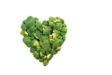 Heart shaped fresh green broccoli isolated on white. Top view.の写真素材