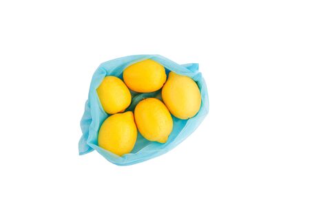Reusable bag with lemons isolated on white background. Zero waste and plastic free shopping concept. Top view.の写真素材
